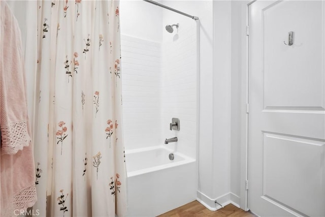 1101 Lasso Way Unit 303, Rancho Mission Viejo, CA 92694 - bathroom featuring shower / bathtub combination with curtain, wood finished floors, and baseboards