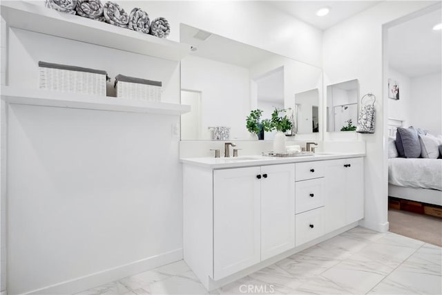 1101 Lasso Way Unit 303, Rancho Mission Viejo, CA 92694 - full bath featuring marble finish flooring, double vanity, ensuite bath, baseboards, and recessed lighting