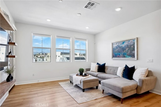 1101 Lasso Way Unit 303, Rancho Mission Viejo, CA 92694 - living area featuring light wood-style floors, baseboards, and recessed lighting