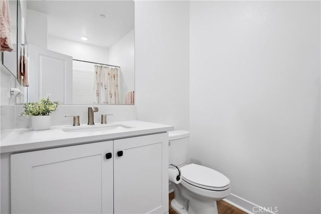 1101 Lasso Way Unit 303, Rancho Mission Viejo, CA 92694 - full bathroom with toilet, vanity, wood finished floors, baseboards, and a shower with curtain