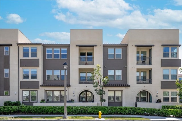 1101 Lasso Way Unit 303, Rancho Mission Viejo, CA 92694 - view of property with uncovered parking