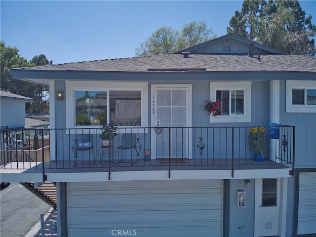 16387 De Anza Cir Unit Ci60, Huntington Beach, CA 92649 - rear view of house featuring an attached garage and a shingled roof