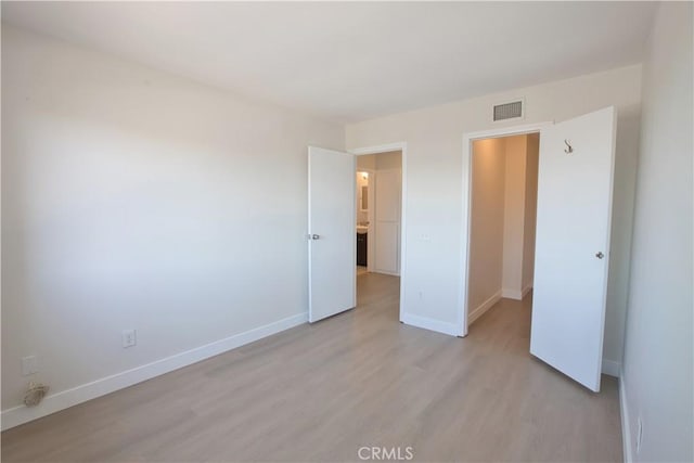 16387 De Anza Cir Unit Ci60, Huntington Beach, CA 92649 - unfurnished bedroom featuring light wood-style flooring and baseboards