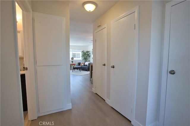 16387 De Anza Cir Unit Ci60, Huntington Beach, CA 92649 - hallway with light wood finished floors