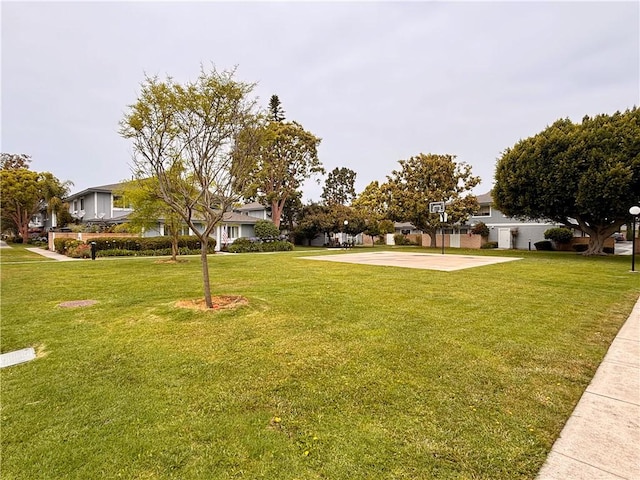 16387 De Anza Cir Unit Ci60, Huntington Beach, CA 92649 - view of green lawn with community basketball court and a residential view