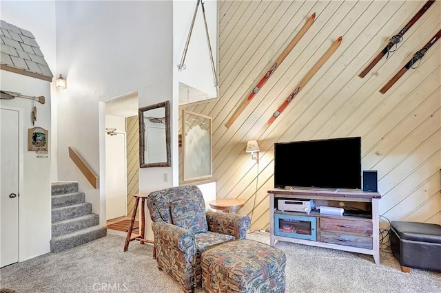 261 Lakeview Blvd Unit 54, Mammoth Lakes, CA 93546 - living area with a towering ceiling, carpet flooring, stairway, and wooden walls
