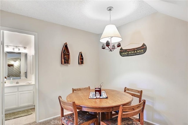 261 Lakeview Blvd Unit 54, Mammoth Lakes, CA 93546 - dining area with light carpet and a textured ceiling