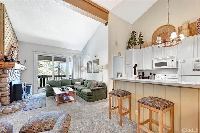 261 Lakeview Blvd Unit 54, Mammoth Lakes, CA 93546 - living room featuring high vaulted ceiling, carpet floors, and a chandelier