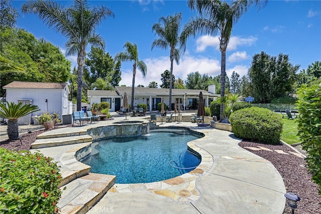 41167 Via Cielito, Temecula, CA 92591 - view of pool featuring a patio area, a pool with connected hot tub, and an outdoor structure