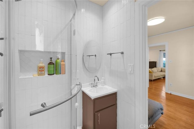 225 E 56th St, Long Beach, CA 90805 - ensuite bathroom with vanity and wood finished floors