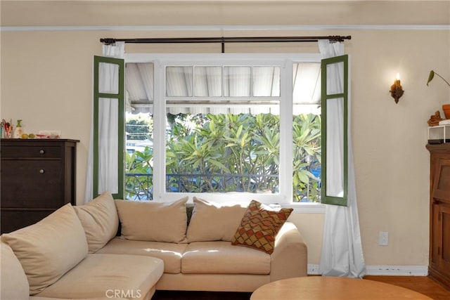 225 E 56th St, Long Beach, CA 90805 - living area with healthy amount of natural light and crown molding