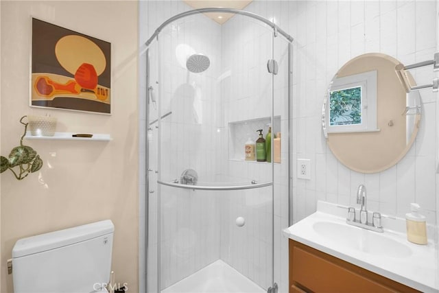 225 E 56th St, Long Beach, CA 90805 - bathroom featuring vanity, a stall shower, decorative backsplash, and tile walls