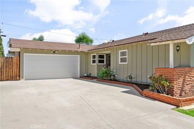 18557 Mescal St, Rowland Heights, CA 91748 - ranch-style home with board and batten siding, a shingled roof, an attached garage, and driveway
