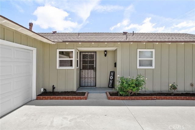 18557 Mescal St, Rowland Heights, CA 91748 - doorway to property featuring board and batten siding, an attached garage, and a shingled roof
