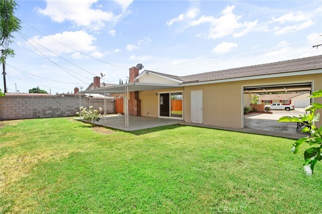 18557 Mescal St, Rowland Heights, CA 91748 - rear view of house with a patio area, stucco siding, and a chimney