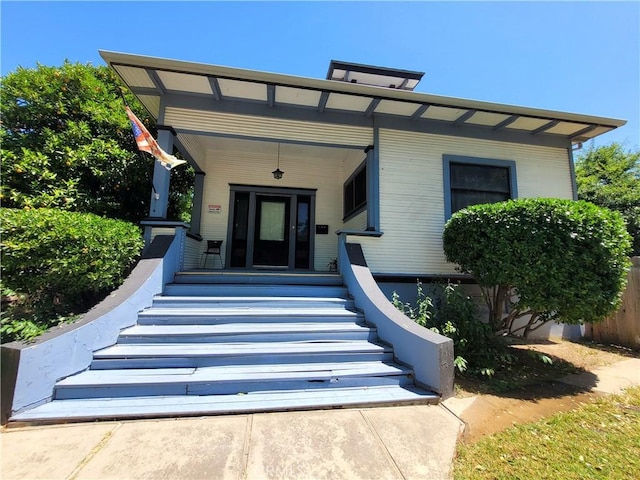 1948 K St, Merced, CA 95340 - doorway to property featuring a porch