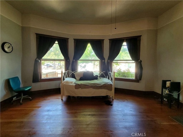 1948 K St, Merced, CA 95340 - bedroom with hardwood / wood-style flooring, multiple windows, and baseboards
