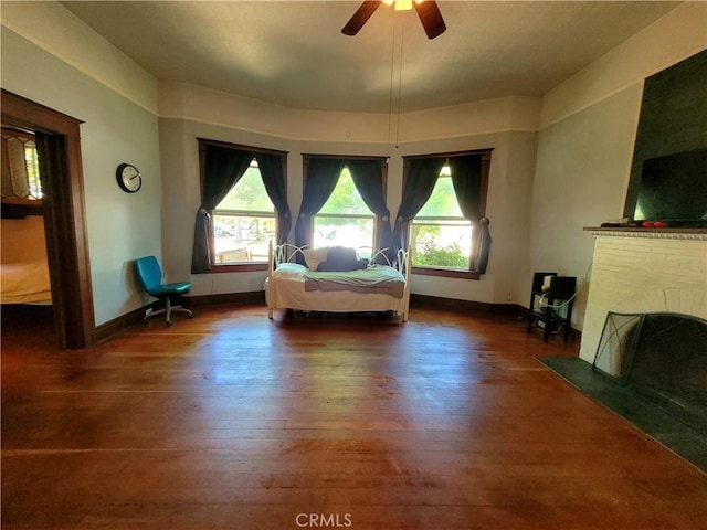 1948 K St, Merced, CA 95340 - living area with hardwood / wood-style flooring, healthy amount of natural light, and a fireplace with flush hearth