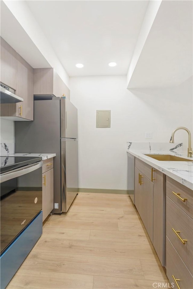 1745 Camino Palmero St Unit 107, Los Angeles, CA 90046 - kitchen with a sink, electric range, light wood-style flooring, light stone countertops, and recessed lighting