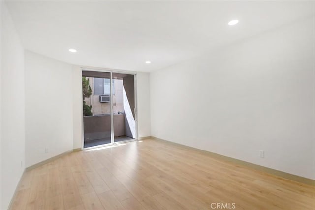1745 Camino Palmero St Unit 107, Los Angeles, CA 90046 - unfurnished room featuring light wood finished floors, recessed lighting, and baseboards