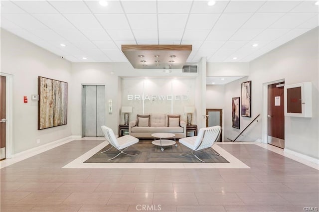 1745 Camino Palmero St Unit 107, Los Angeles, CA 90046 - living area featuring elevator, baseboards, and recessed lighting