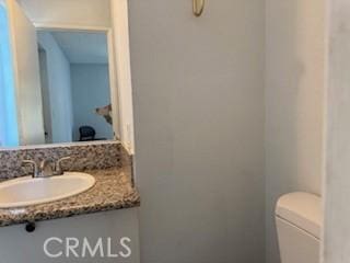 2208 N N Broadway Unit 33, Santa Ana, CA 92706 - half bathroom with vanity and toilet