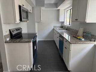 2208 N N Broadway Unit 33, Santa Ana, CA 92706 - kitchen with appliances with stainless steel finishes, baseboards, and a sink