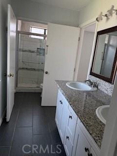 2208 N N Broadway Unit 33, Santa Ana, CA 92706 - bathroom featuring double vanity, a stall shower, and tile patterned floors
