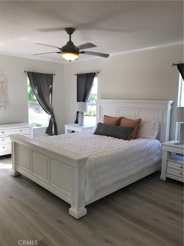 35450 Calle Nopal, Temecula, CA 92592 - bedroom featuring crown molding, multiple windows, wood finished floors, and a ceiling fan