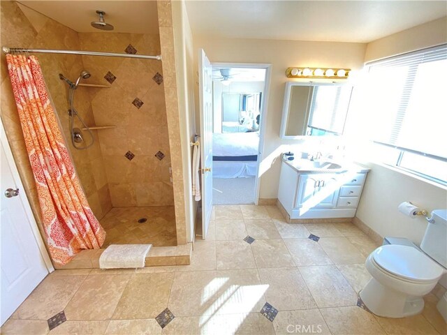 35450 Calle Nopal, Temecula, CA 92592 - full bathroom with a tile shower, vanity, tile patterned flooring, and a ceiling fan
