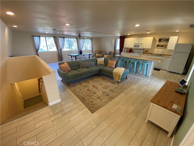 35450 Calle Nopal, Temecula, CA 92592 - living area featuring light wood-style floors, recessed lighting, and ceiling fan
