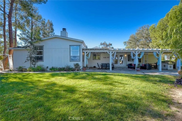 35450 Calle Nopal, Temecula, CA 92592 - rear view of house with french doors, a lawn, a patio, and a chimney