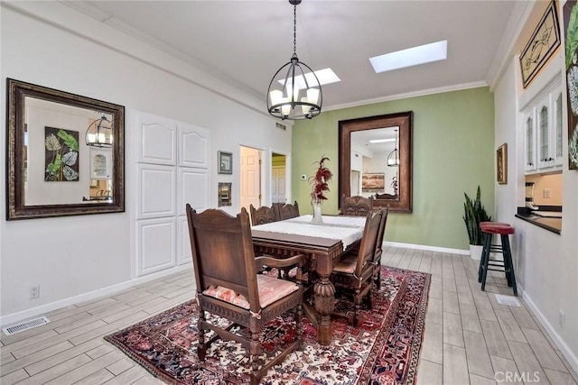 35450 Calle Nopal, Temecula, CA 92592 - dining room featuring a skylight, wood tiled floors, a chandelier, and ornamental molding