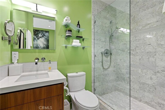 1088 Del Mar Ave, Laguna Beach, CA 92651 - bathroom featuring toilet, walk in shower, vanity, and backsplash