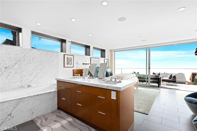 1088 Del Mar Ave, Laguna Beach, CA 92651 - kitchen with open floor plan, brown cabinets, modern cabinets, a wall of windows, and recessed lighting