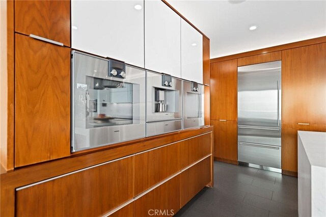 1088 Del Mar Ave, Laguna Beach, CA 92651 - kitchen with built in refrigerator, modern cabinets, brown cabinetry, and white cabinets