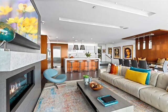 1088 Del Mar Ave, Laguna Beach, CA 92651 - living room with a glass covered fireplace, wood finished floors, and recessed lighting