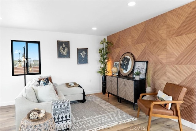 1561 Shoshone Valley Rd Unit 29, Palms, CA 92277 - living room with an accent wall, baseboards, recessed lighting, and wood finished floors