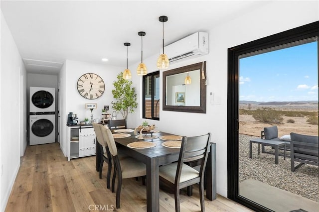 1561 Shoshone Valley Rd Unit 29, Palms, CA 92277 - dining area featuring estacked washer and dryer, a wall mounted air conditioner, light wood-style floors, and recessed lighting
