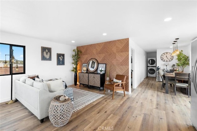 1561 Shoshone Valley Rd Unit 29, Palms, CA 92277 - living room with stacked washer and clothes dryer, light wood-type flooring, recessed lighting, and baseboards