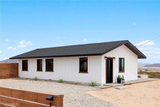 1561 Shoshone Valley Rd Unit 29, Palms, CA 92277 - view of front facade with a shingled roof and a mountain view