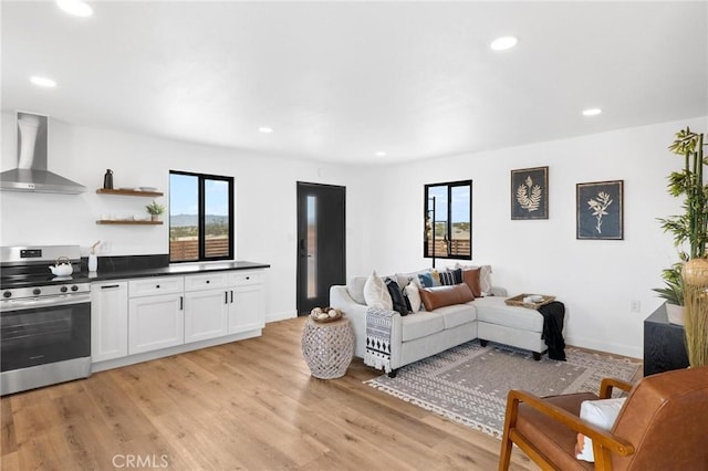 1561 Shoshone Valley Rd Unit 29, Palms, CA 92277 - living room with light wood-type flooring and recessed lighting
