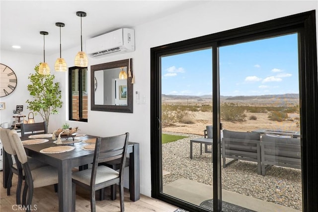 1561 Shoshone Valley Rd Unit 29, Palms, CA 92277 - dining room with a wall unit AC and light wood finished floors