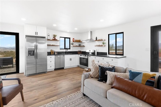 1561 Shoshone Valley Rd Unit 29, Palms, CA 92277 - living area featuring light wood-style flooring and recessed lighting