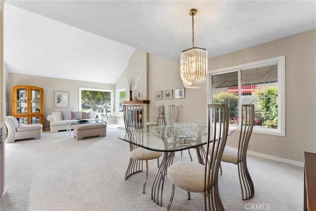 6421 Acacia Hill Dr, Yorba Linda, CA 92886 - dining space featuring carpet, a chandelier, baseboards, a fireplace, and a towering ceiling