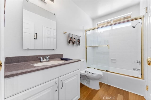 6421 Acacia Hill Dr, Yorba Linda, CA 92886 - full bathroom with vanity, wood finished floors, toilet, and bath / shower combo with glass door