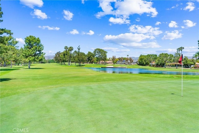 6421 Acacia Hill Dr, Yorba Linda, CA 92886 - view of property's community with view of golf course, a water view, a yard, and a putting area