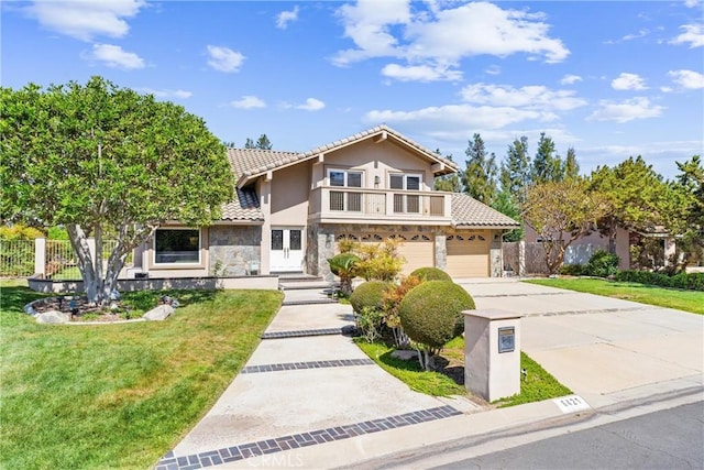 6421 Acacia Hill Dr, Yorba Linda, CA 92886 - traditional-style home with stone siding, driveway, a tile roof, and stucco siding