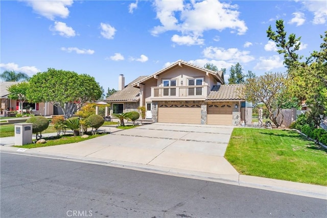 6421 Acacia Hill Dr, Yorba Linda, CA 92886 - view of front facade with a tiled roof, a garage, concrete driveway, stone siding, and stucco siding