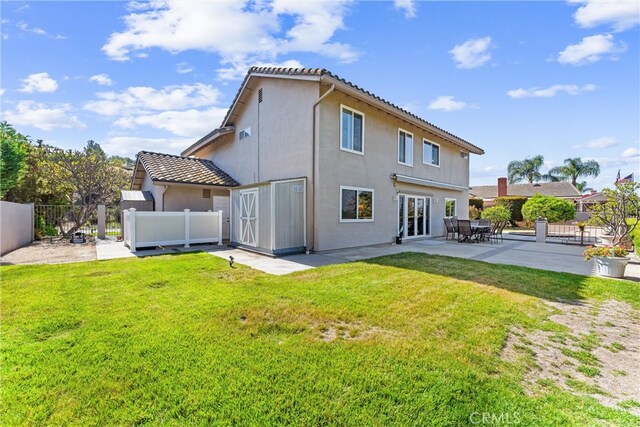 6421 Acacia Hill Dr, Yorba Linda, CA 92886 - back of property featuring a patio area, stucco siding, and a tile roof